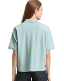 Polo de mujer de manga corta con cuello polo y diseño liso