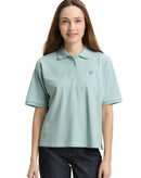 Polo de mujer de manga corta con cuello polo y diseño liso