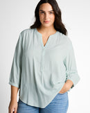 Blusa de manga larga camisera de mujer con cuello de pico y rayas finas